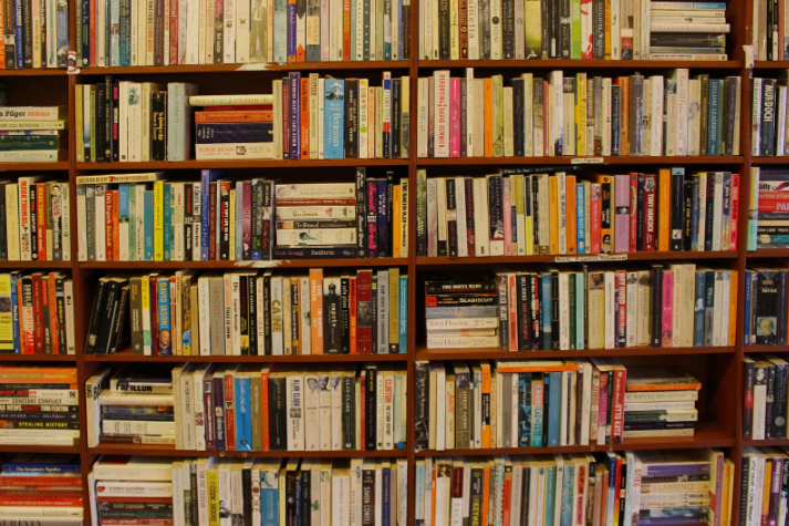 A picture of books tighly packed on shelves