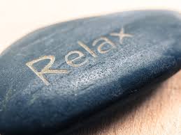 Image of rock with the word "relax" written across the top. Image labelled for noncommercial use rights.