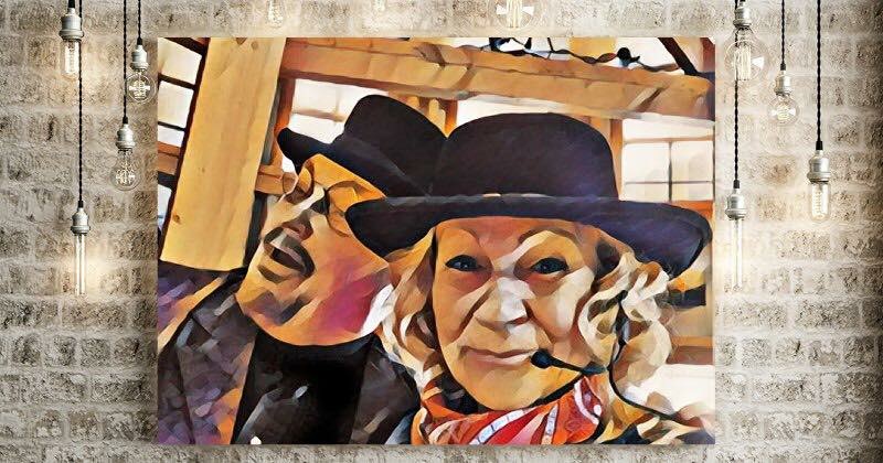 Dave and Connie Elstun are pictured in a stylized painting wearing black cowboy hats