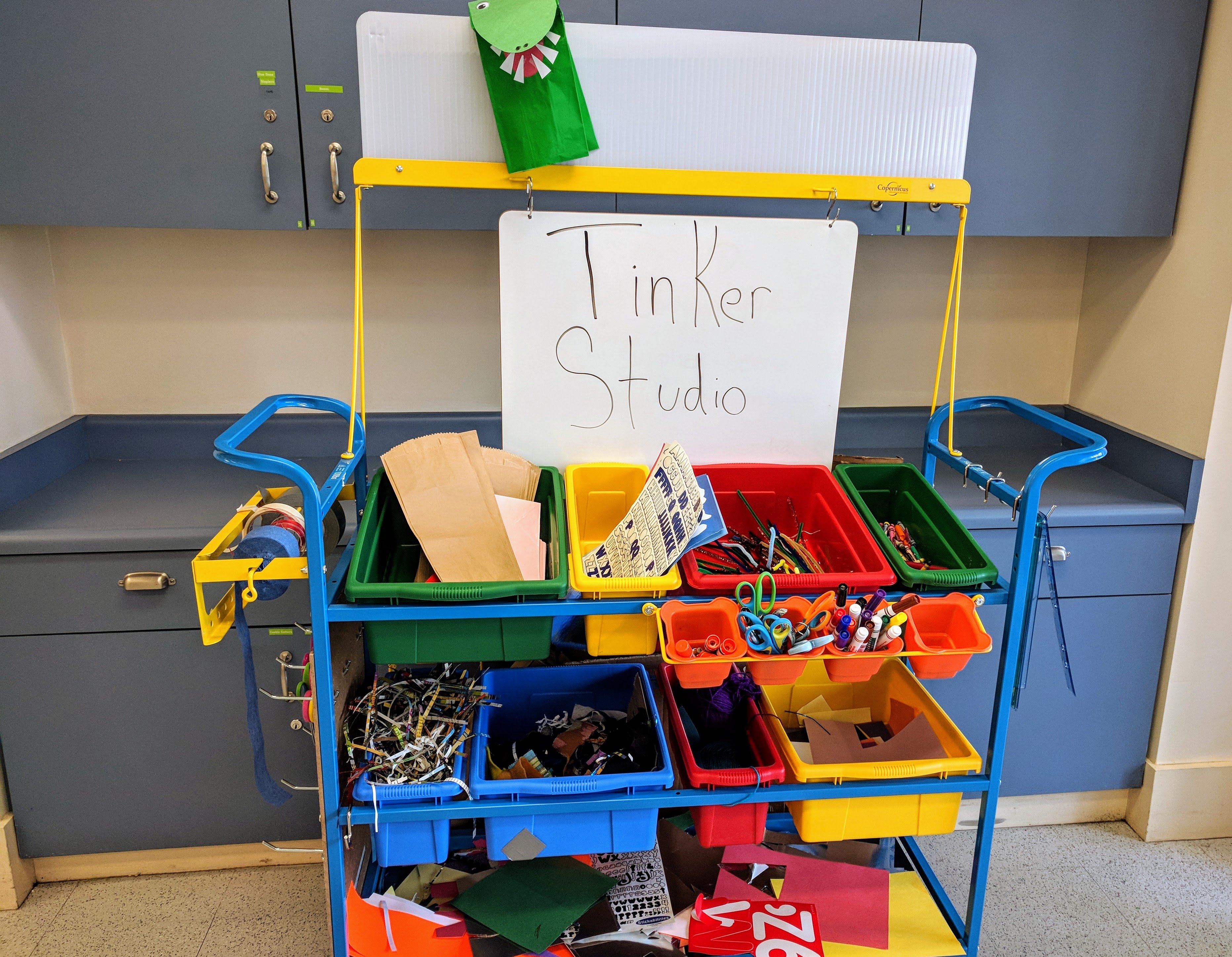 Image of cart with supplies for crafts and projects.