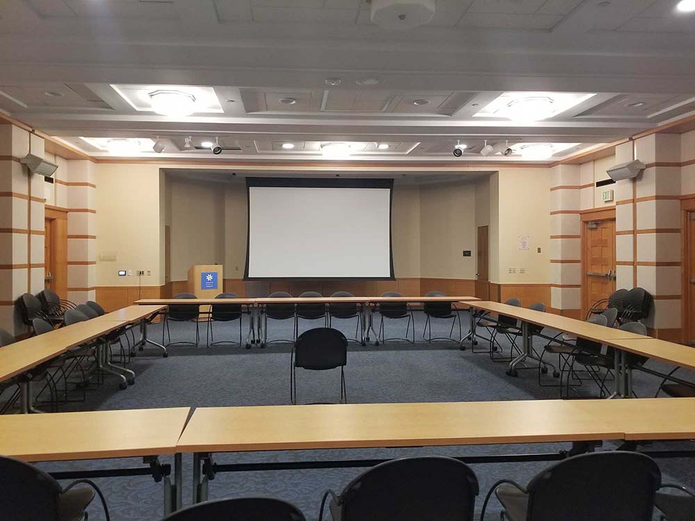 Conference Center A, B, & C with seating and projector screen