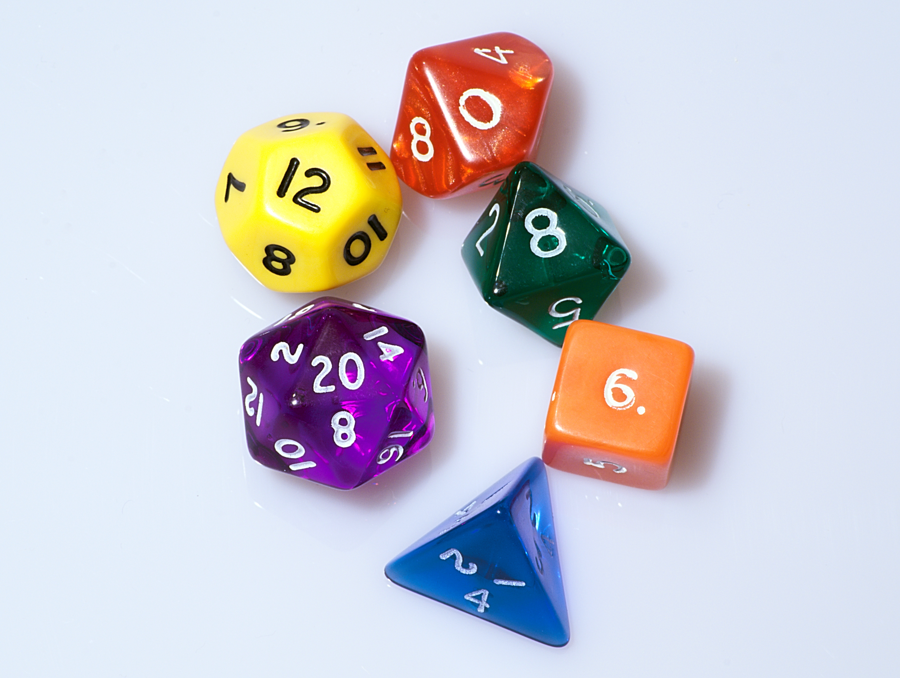 a photo of different colored gaming dice used for D&D