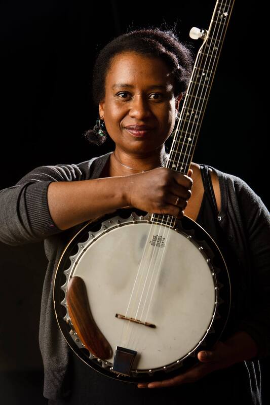Saja Butler holding a banjo