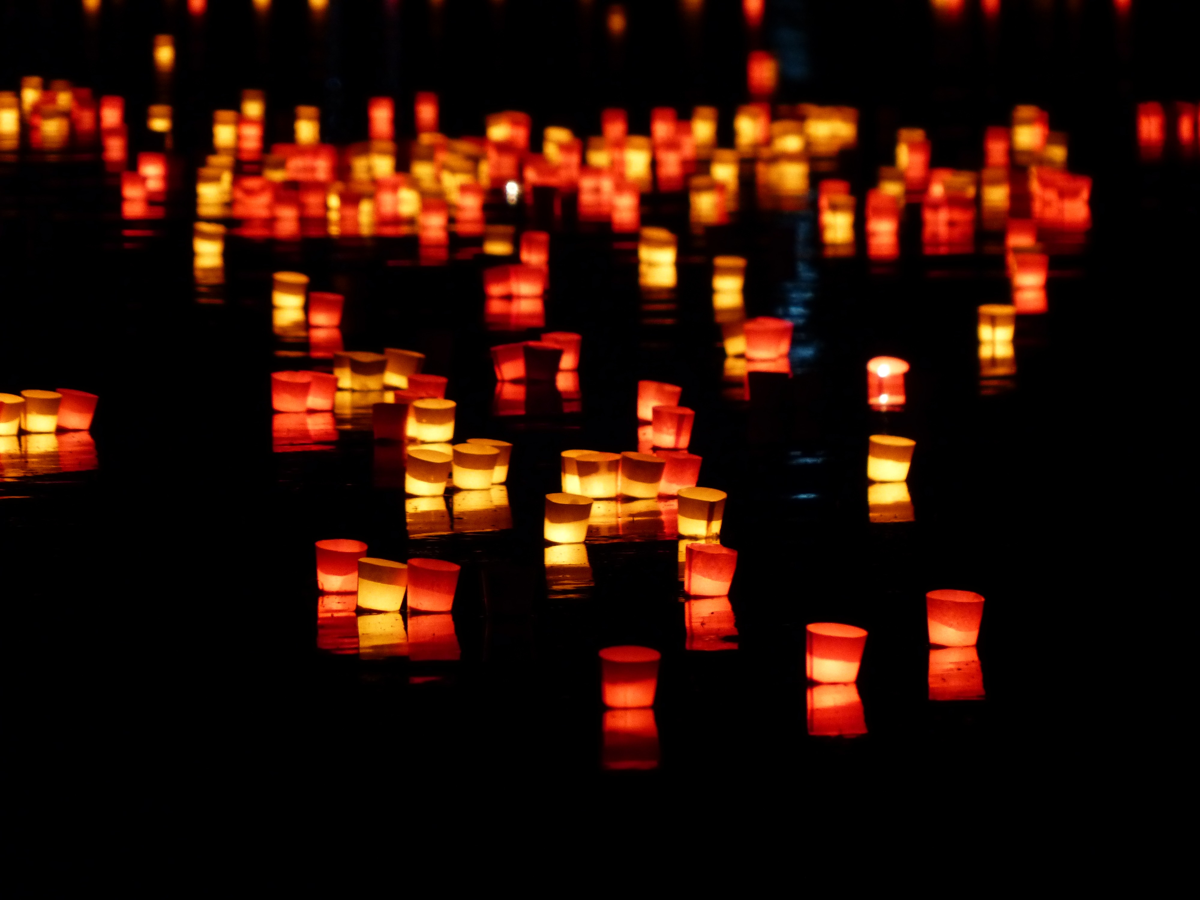 Image of candles on the ground.  
