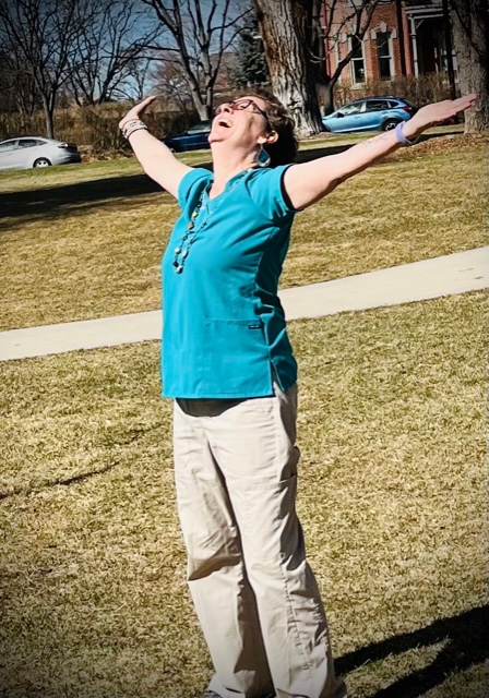 Teacher Lisa Lowe practicing qi gong in the park