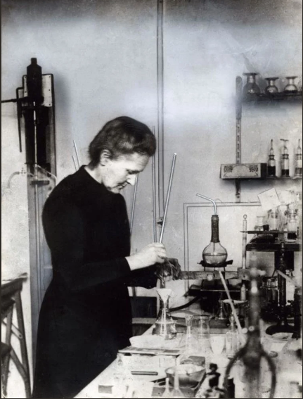 Black and white image of Marie Curie in her chemistry laboratory