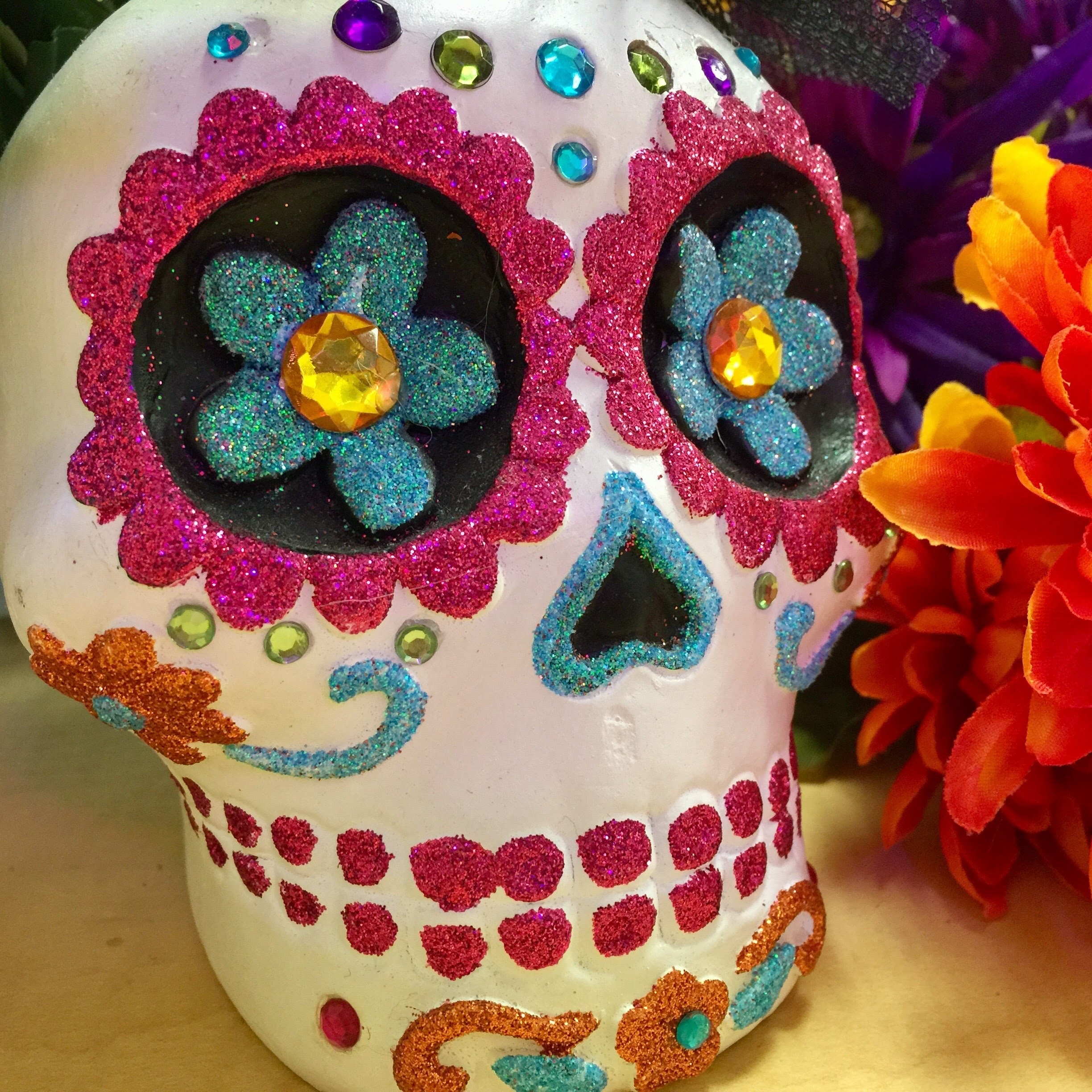 large sugar skull decorated with different colors 