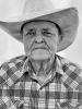 Older LGBTQ individual in western wear