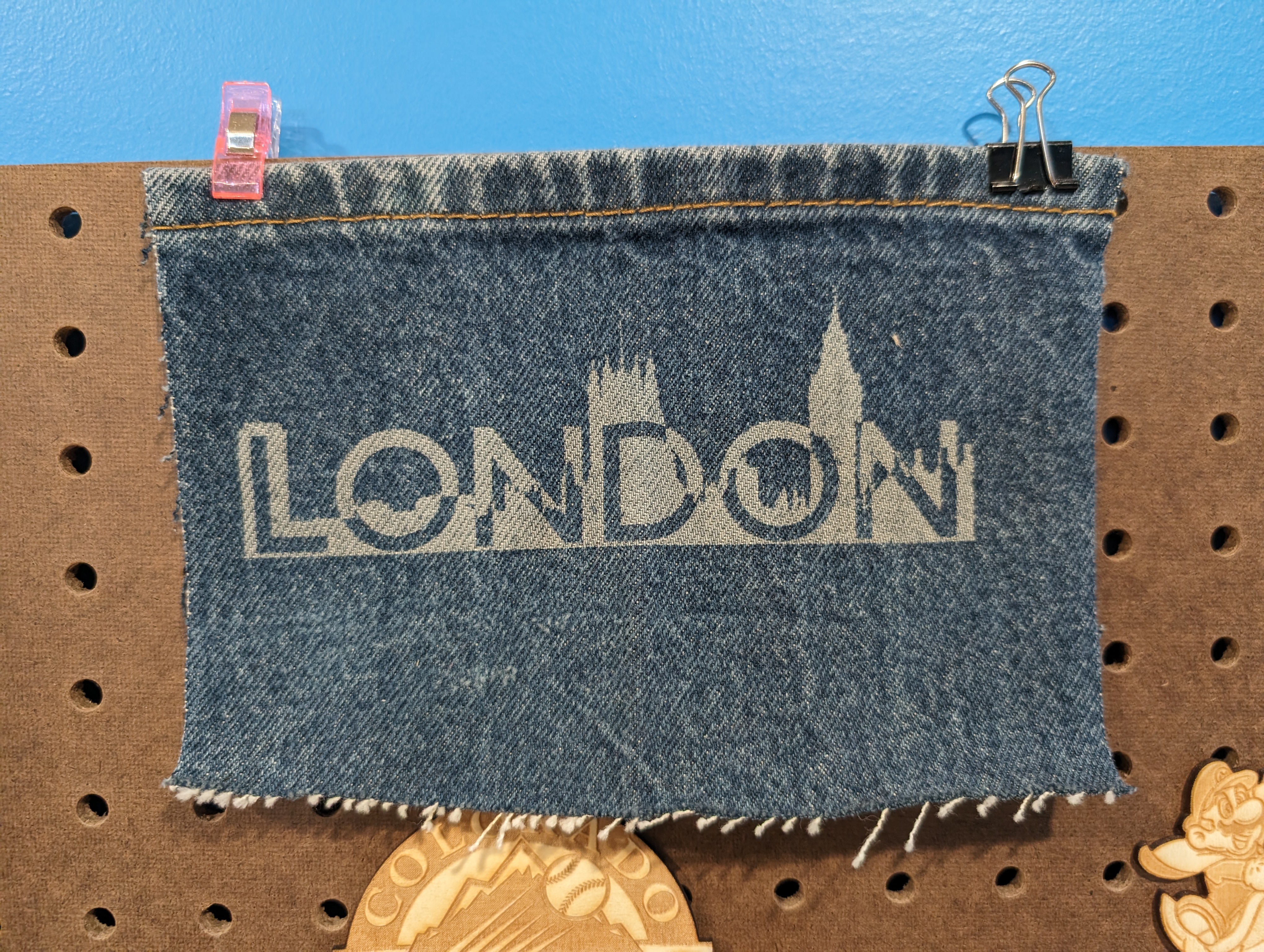 London logo etched on denim