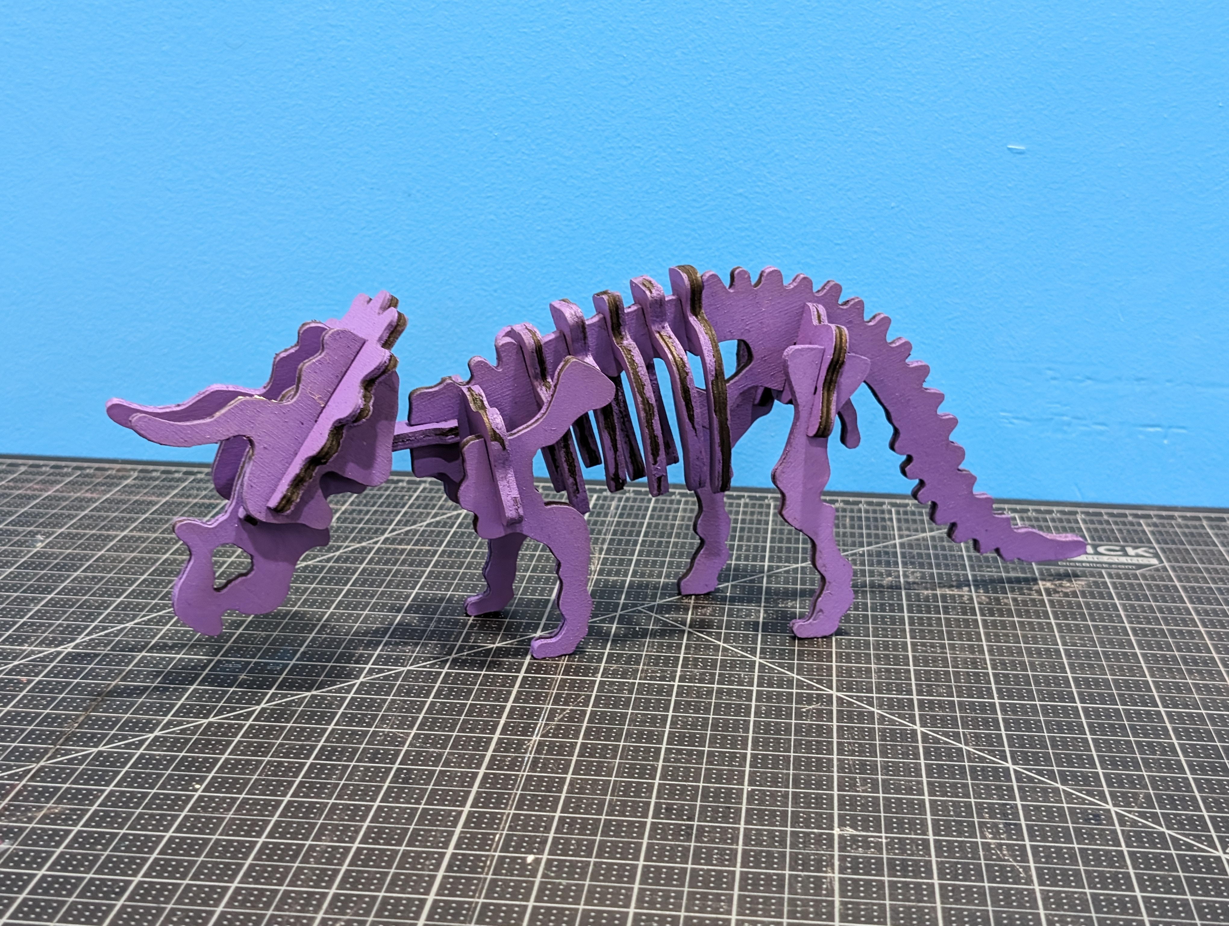 wooden triceratops skeleton painted purple