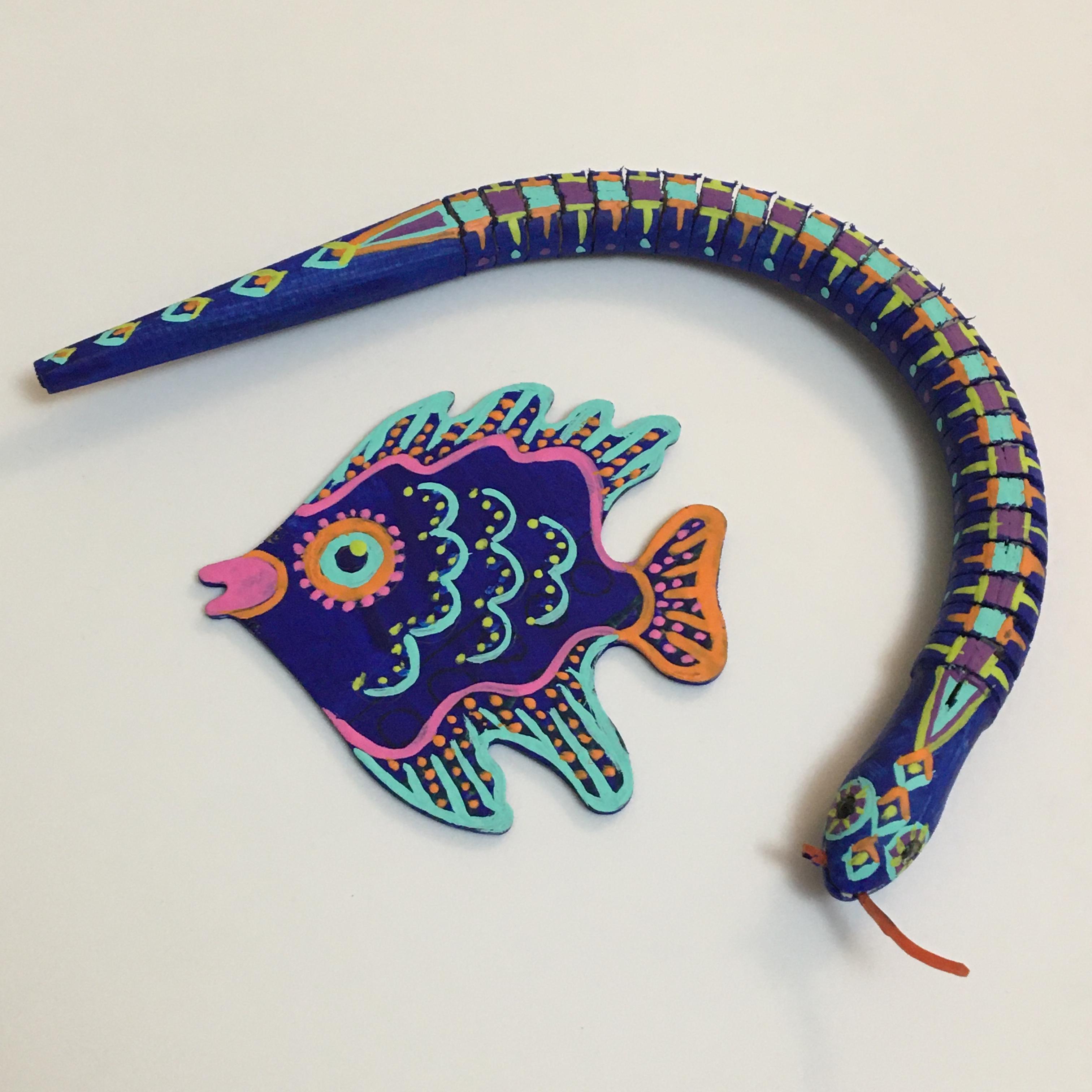 Bright hand painted snake and fish. 