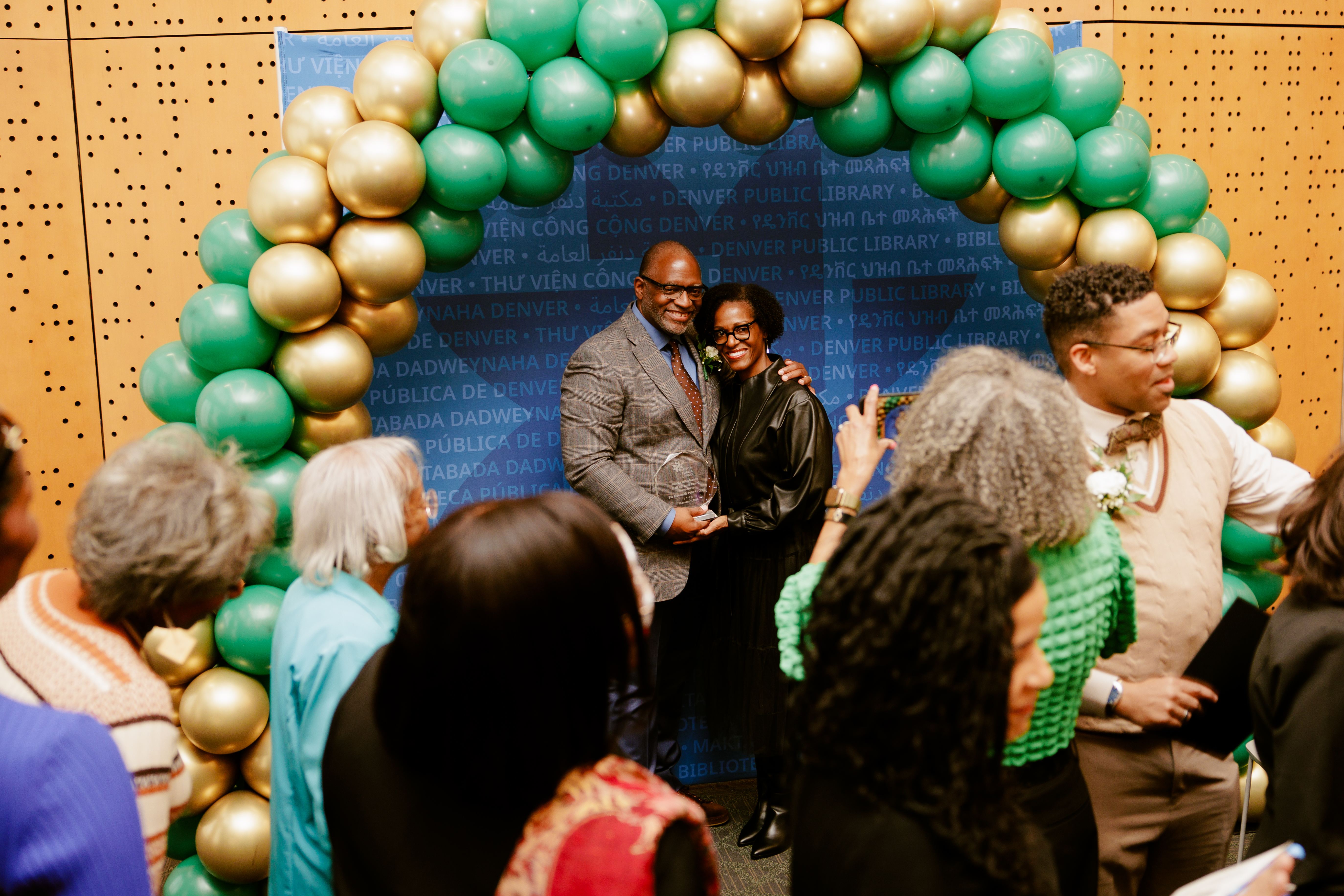 2026 Juanita Gray awardee posing in front of DPL backdrop and balloon arch.