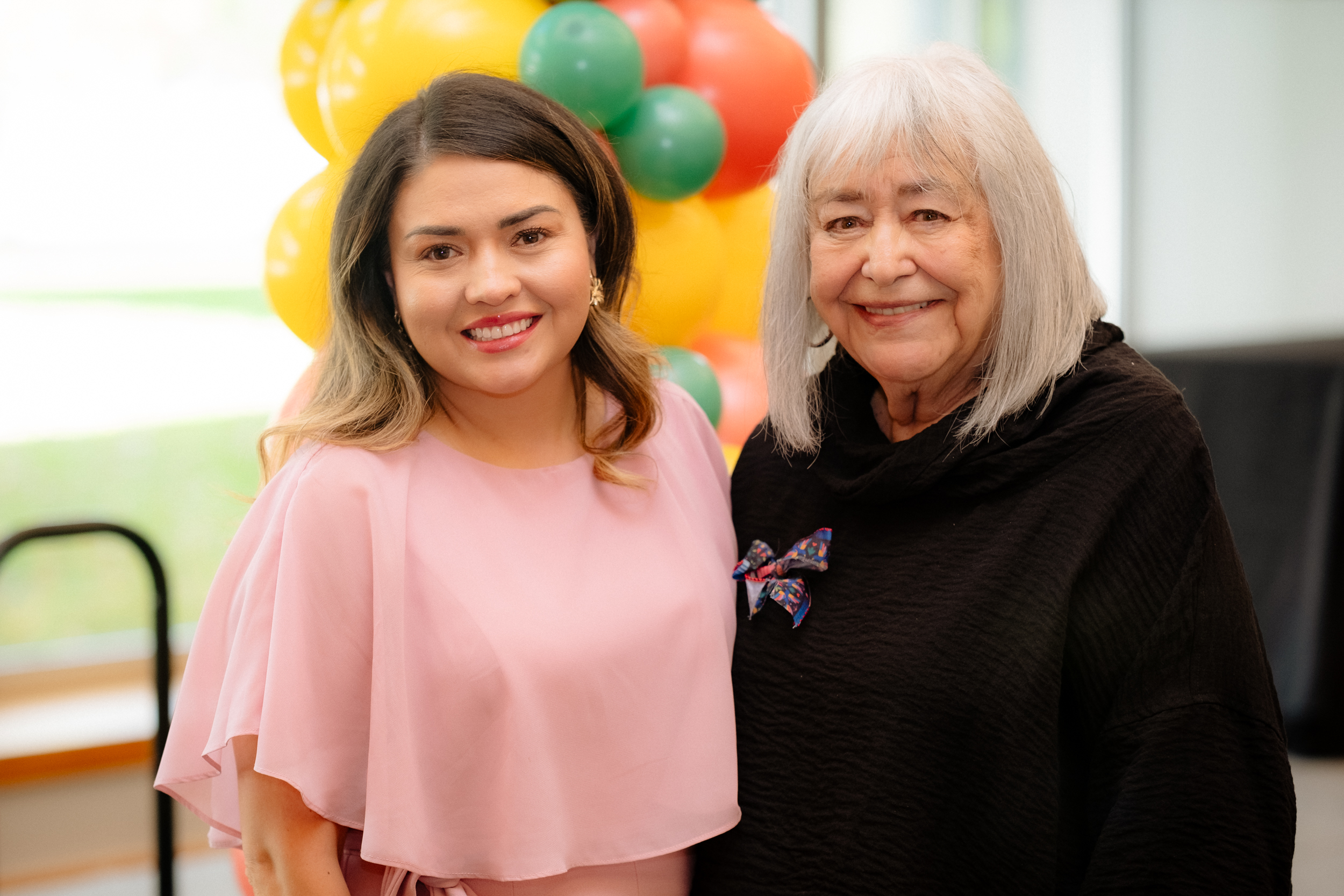 The Latino Community Service Awards ceremony featuring Erlinda Archuleta, an award recipient from 2025 and a Latino Community Service Awards selection committee member smiling and posing for the camera.