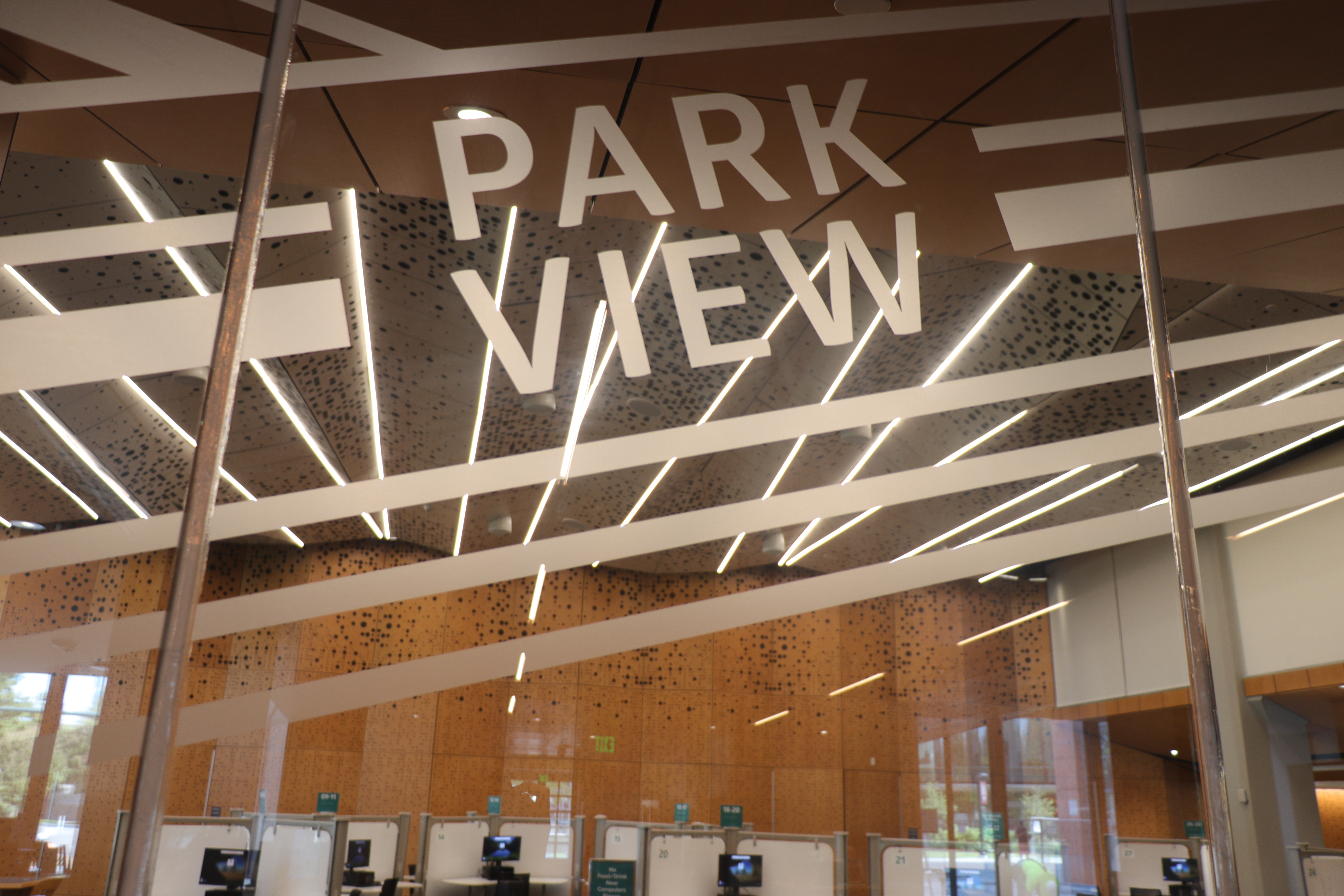 Etched glass with the words "Park View". Behind the glass is a view of the new event space.