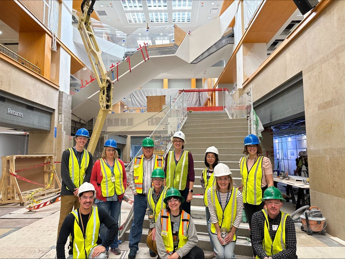 DPL staff pose for a picture in front of the near complete, Grand Staircase.