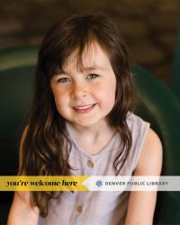Smiling young girl with a You're Welcome Here banner near the bottom