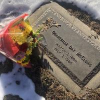 Quantrille McClung's grave site at Crown Hill Cemetery with a bright bunch of flowers