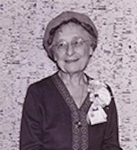 Quantrille D. McClung wearing a hat, corsage and smiling