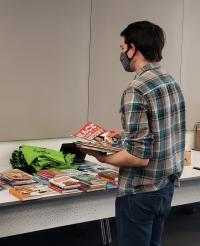 Staff member sorting books for distribution