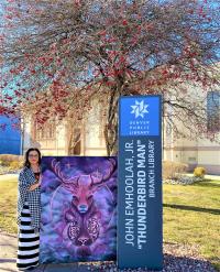 Karma Leigh outside the Thunderbird Man Branch Library