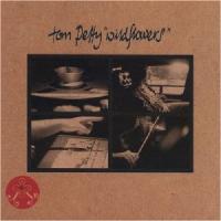 Tom Petty album cover with black and white images of the band recording music