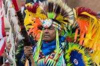 Brad Bearsheart leads the grand entry at the DU Spring Powwow in Denver Colorado.