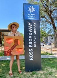 Lindee Zimmer holds a piece of her artwork outside the Ross-Broadway Branch Library