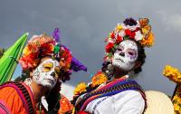 Women with face paint, photo by Rebeca Anchondo, Creative Commons license