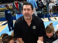 Photo of Mark Randall working with youth during a basketball game.