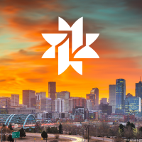 orange dusky sky and white denver public library bookstar over denver skyline