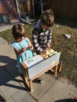 Photo of two children making crafts