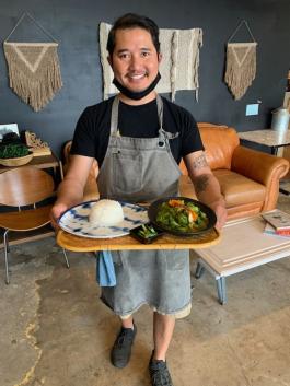 Co-owner of Urban Burma-Siri Tan serving our CI committee member some yumminess