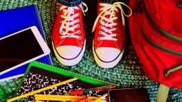 Image by Wokandapix from Pixabay; student's sneakers surrounded by school supplies