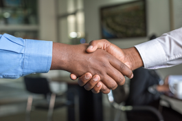 Two people shaking hands. Photo by Cytonn Photography on Unsplash