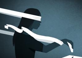 Image shows the stylized outline of a person casting a ballot while being blinded by ribbons.