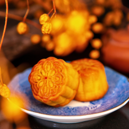 Photograph of moon cake on blue plate. 