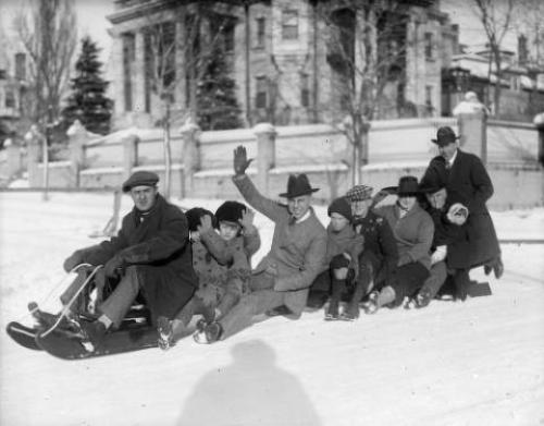 Group sledding in Denver by Harry Rhodes (taken between 1920 and 1940)