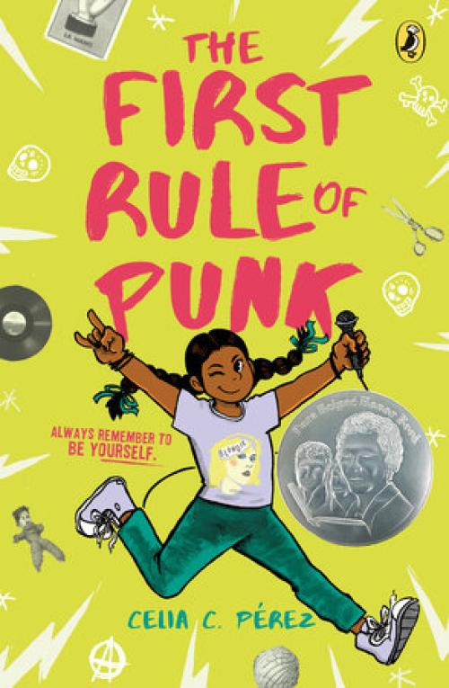  The First Rule of Punk book cover with a girl with braids and brown skin, smiling and winking while holding a mic.