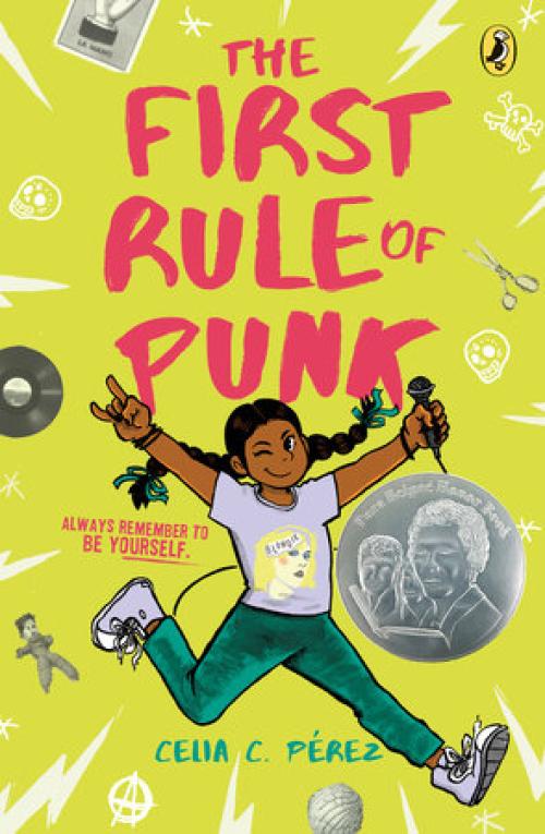 The First Rule of Punk book cover with a girl with braids and brown skin, smiling and winking while holding a mic.