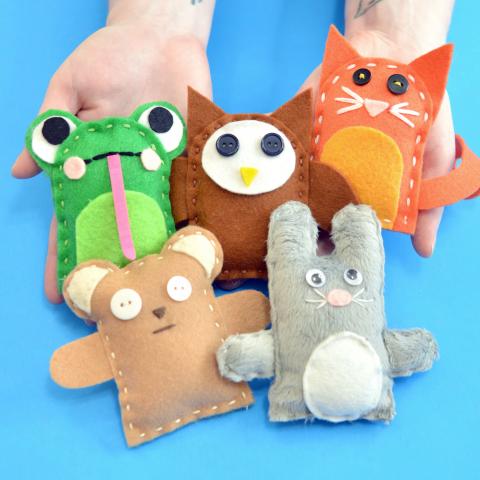 Hands holding handmade plushie examples: a frog, owl, cat, bear, and bunny.