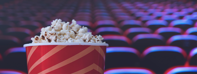 Pop corn and on red armchair cinema
